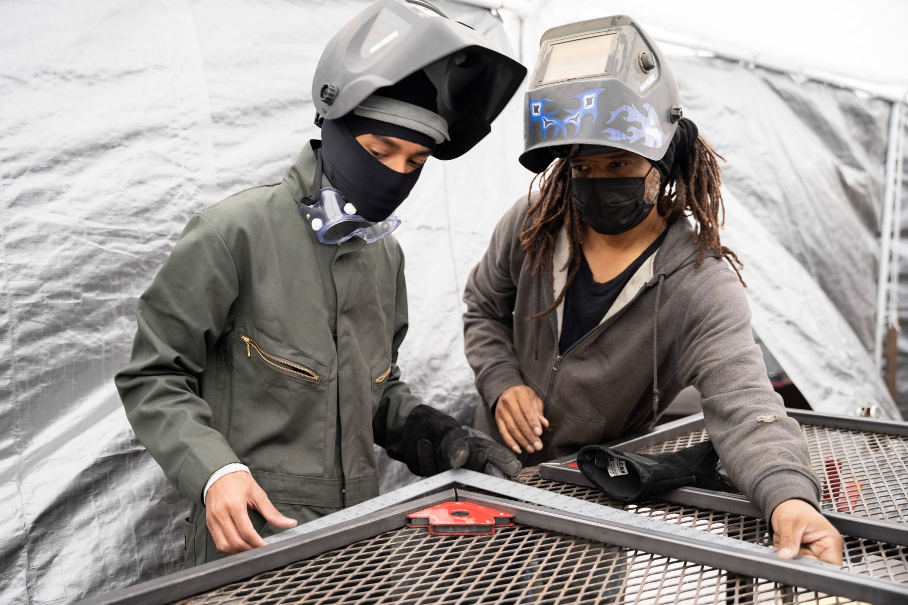Jermaine Lindsey with a collaborator at the welding table